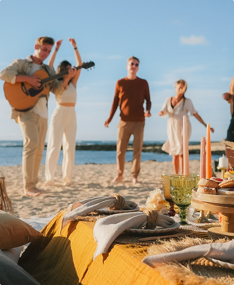 Beach picnic with gourmet food and live music.